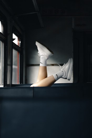 Person Wearing White Shoes