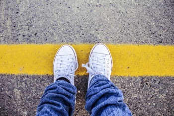 Person Wearing White Sneakers
