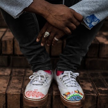 Person Wearing White Sneakers