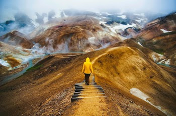 Person Wearing Yellow Hoodie While Going Down