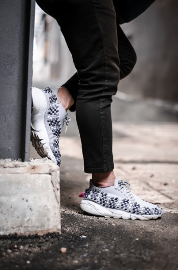 Person Wears Pair of Gray Low-top Sneakers