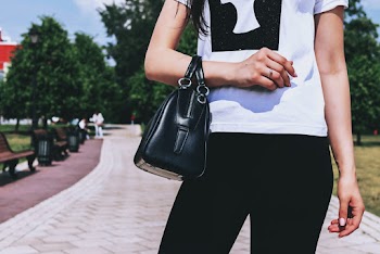 Person With Black Leather Bag Standing Outdoor