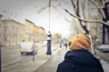 Person With Brown Hat Walking on Street