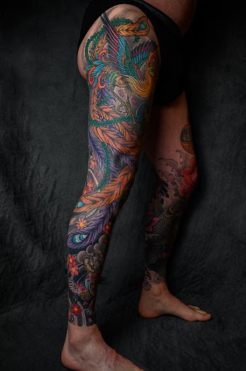 Person With Floral Leg Tattoo Standing