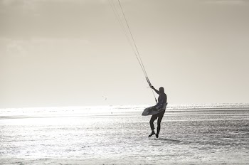 Person With Parachute Strings Grayscale Photo
