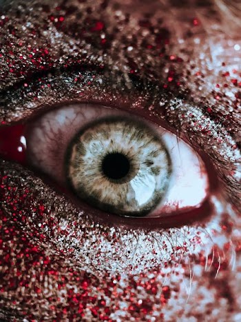 person with red and silver eyeshadow
