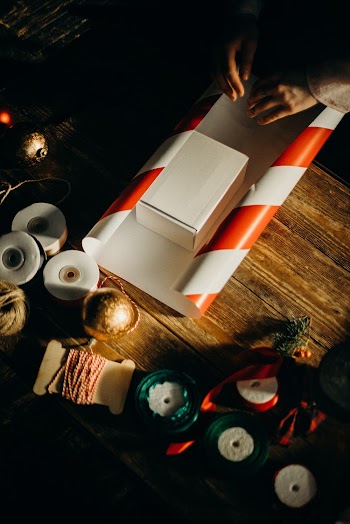 Person Wrapping White Box