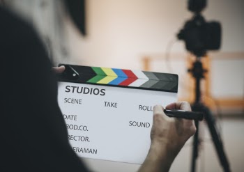 Person Writing Clapboard
