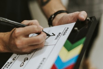 Person Writing on Board