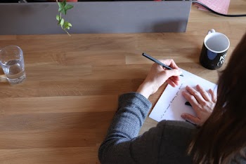 Person Writing on Paper