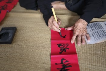 Person Writing on Paper