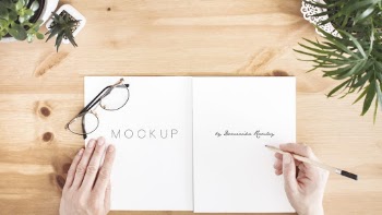 Person Writing on White Notebook