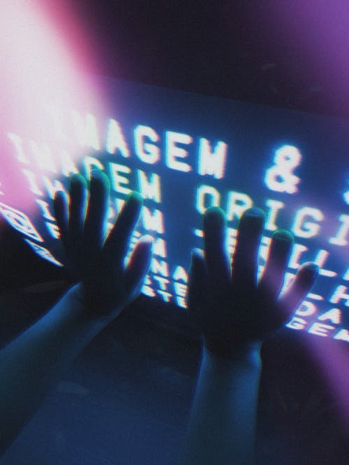 Persons Hand on Black Flat Screen Tv · Free Stock Photo