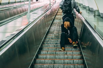 Persons on Escalator