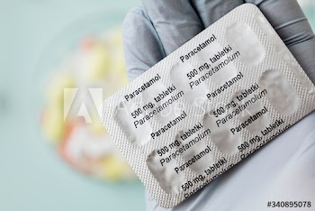 Pharmacist holding paracetamol pain killers