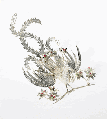 Phoenix standing on hair comb | Free Photo - rawpixel