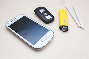 Phone, car key, lighter &amp; cigarettes