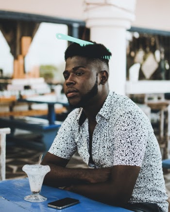Photo Man Wearing White Button-up Collared Shirt With Hair Comb on the Hair Eating Ice Cream