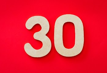 Photo of 30 Against Red Backgrund