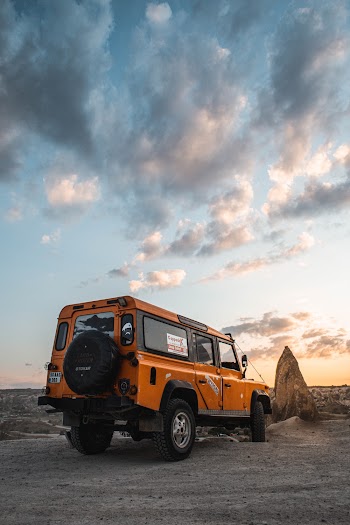 Photo of 4x4 Vehicle Parked on Dirt Road