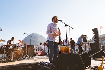 Photo of a Band Playing on Stage