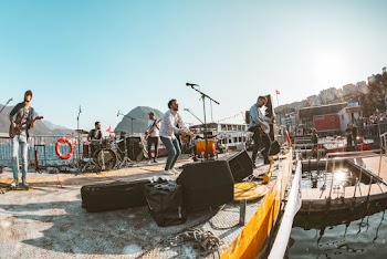 Photo of a Band Playing on Stage