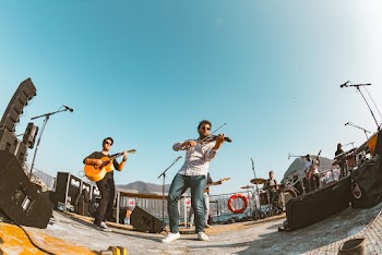 Photo of a Band Playing on Stage