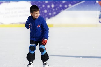 Photo of a boy smiling while skating