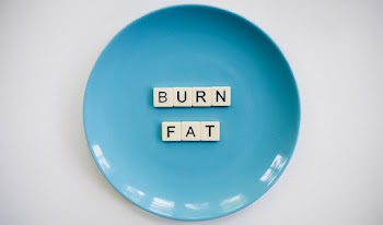 Photo of a Burn Fat Text on Round Blue Plate
