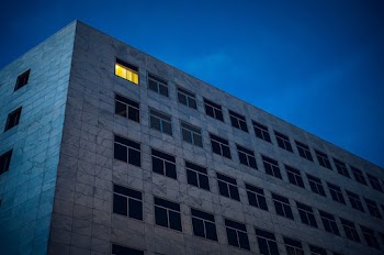 Photo of a grey concrete building during night time