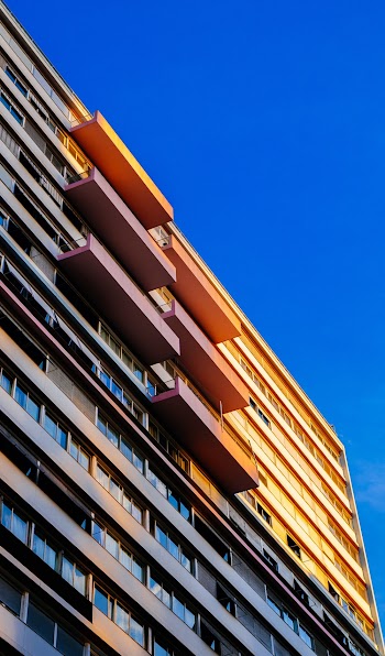 Photo of a high-rise building with balconies during daytime