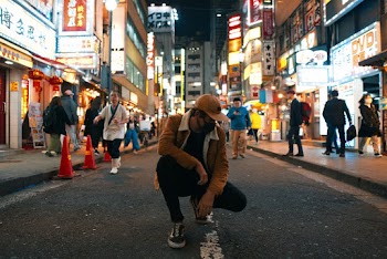 Photo of a Man in the Middle of the Road