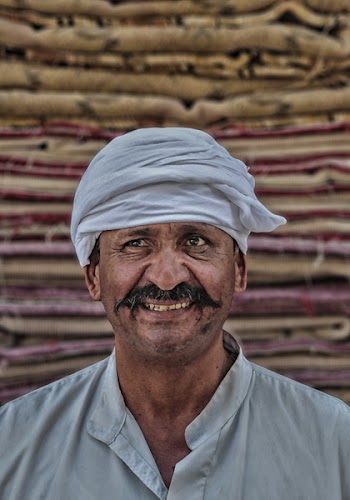 Photo of a Man in White Buttoned-up Top