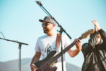Photo of a Man Playing Electric Guitar 