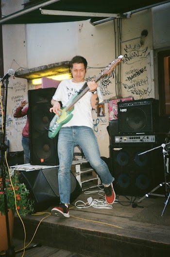 Photo of a Man Playing Guitar