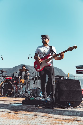 Photo of a Man Playing Guitar on Stage