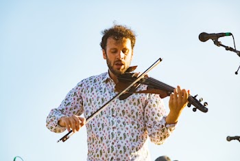 Photo of a Man Playing Violin