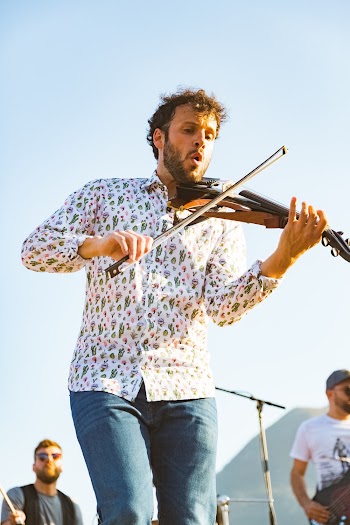 Photo of a Man Playing Violin on Stage