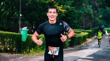 Photo of a Man Running Outdoors