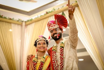 Photo of a Man Standing Beside Woman