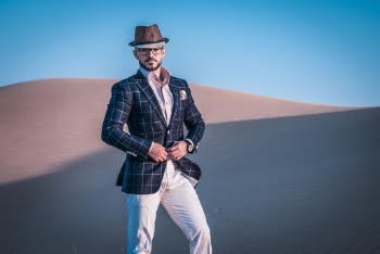 Photo of a Man Standing in Desert