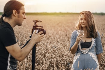 Photo of a Man Taking Photo of a Woman 