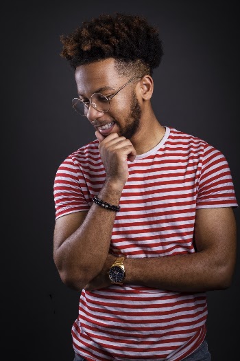 Photo of a Man wearing a White and Red striped Crew-neck T-shirt