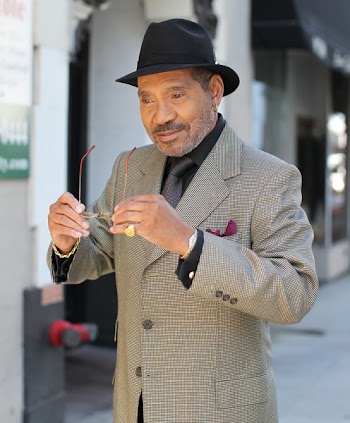 Photo of a Man Wearing Black Fedora Hat