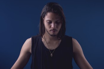Photo of a Man Wearing Black Sleeveless Shirt