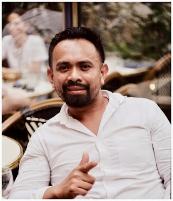 Photo of a Man Wearing White Long-sleeved Shirt