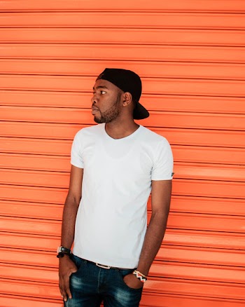 Photo of a Man Wearing White T-shirt
