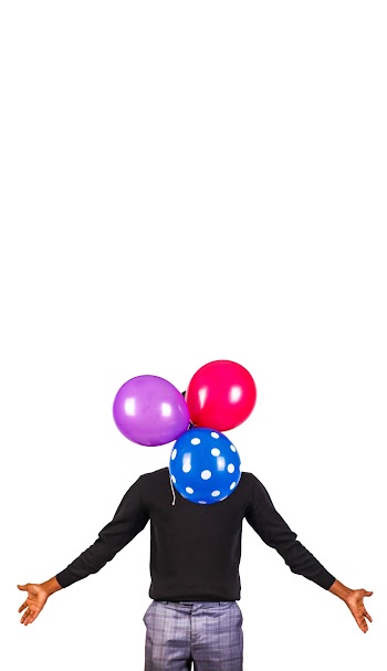 Photo of a Man with his hands spread out While  Covering his face with three balloons