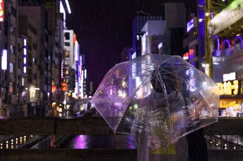 Photo of a Person Holding an Umbrella