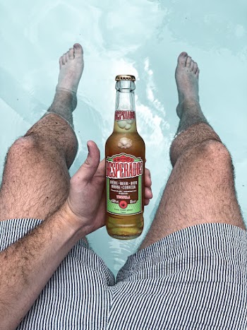 Photo of a Person Holding Bottle
